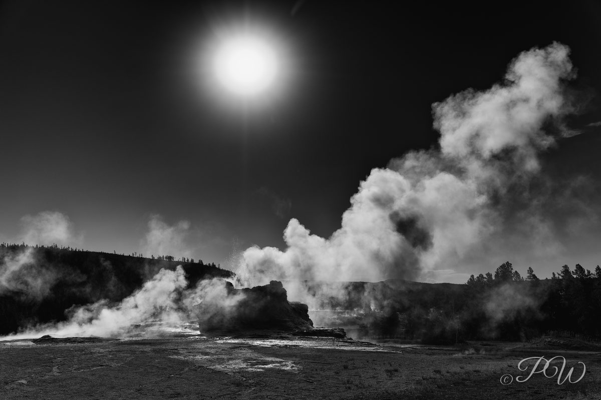 Yellowstone geyser steam and sun (black and white)